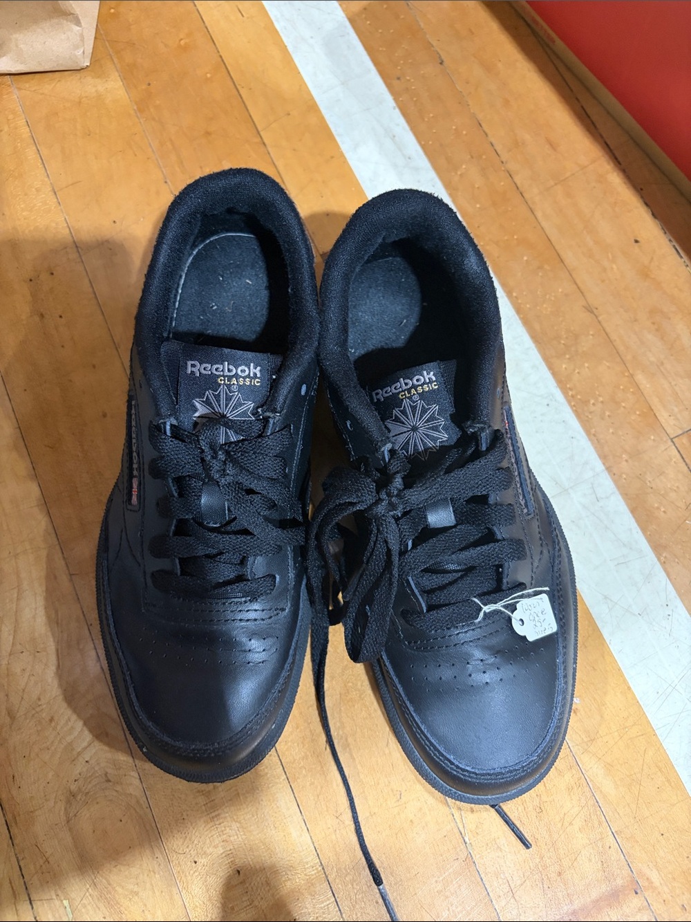 Reebok Classic Men's Black Leather Sneakers with Subtle Red Accent
